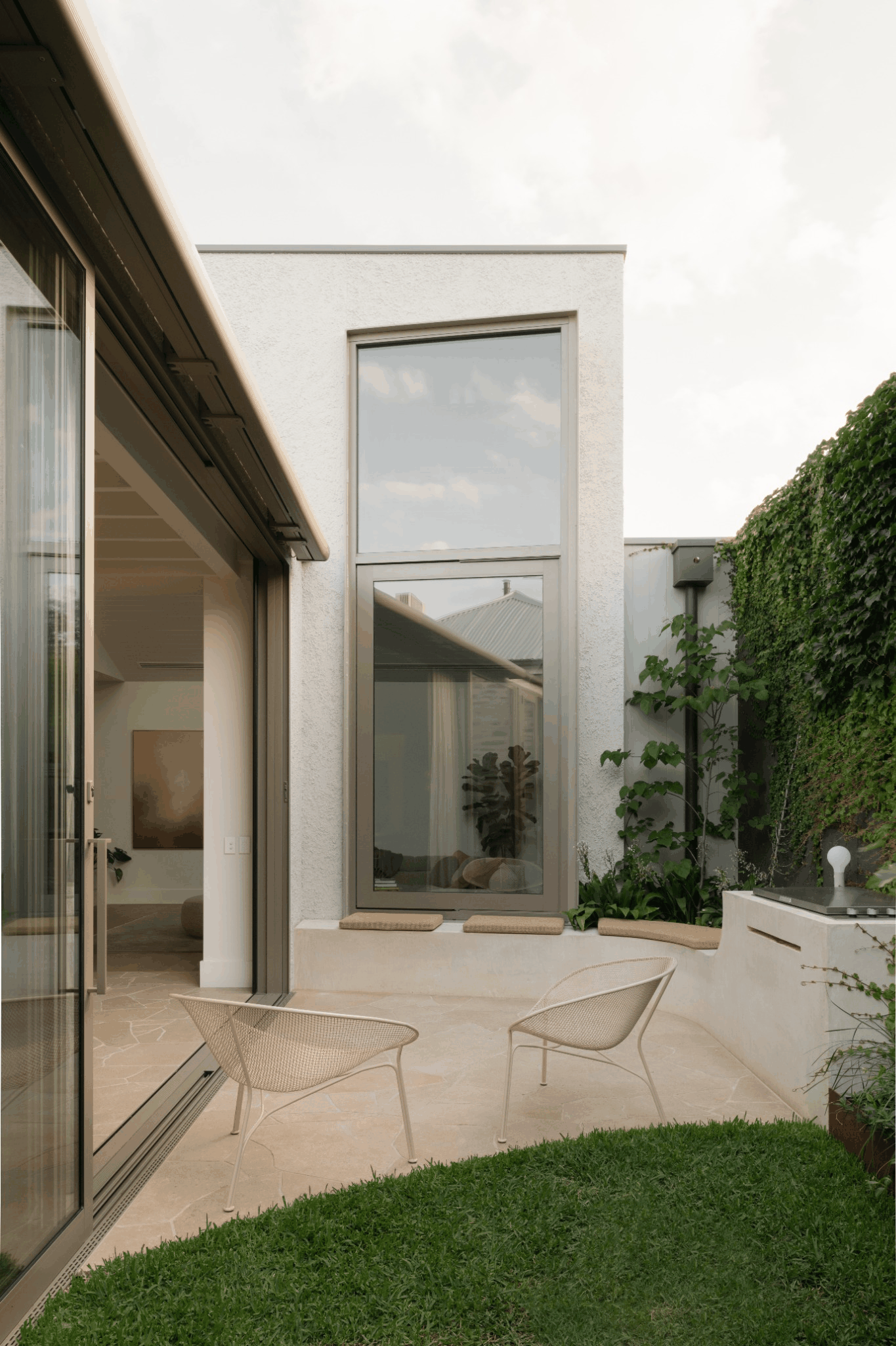 pivot window, steel framed, stucco, crazy paving, sliding doors, inside outside, courtyard, Proske